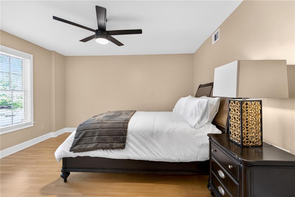 7830 Llangollen Way Cumming, GA 30041 - Photo 50 of 60 a bedroom with a bed and window