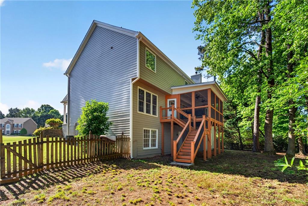 7830 Llangollen Way Cumming, GA 30041 - Photo 51 of 60 a front view of a house with a yard