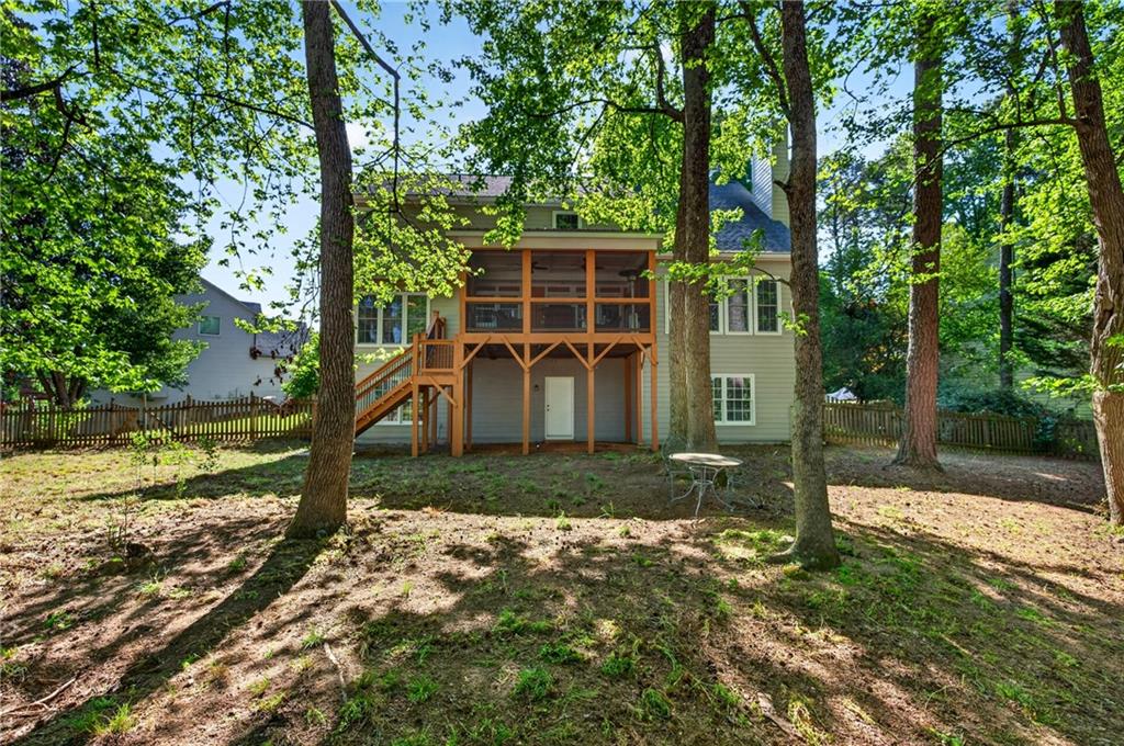 7830 Llangollen Way Cumming, GA 30041 - Photo 52 of 60 front view of a house with a yard