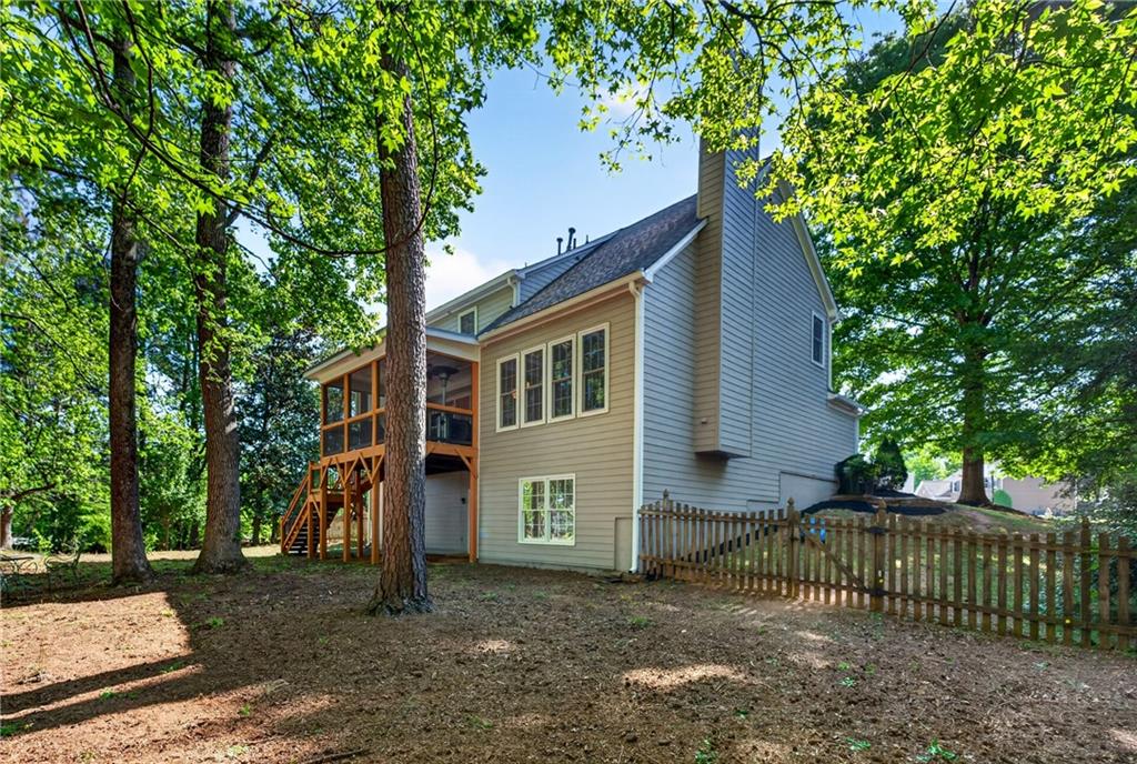 7830 Llangollen Way Cumming, GA 30041 - Photo 53 of 60 a view of a house with a yard