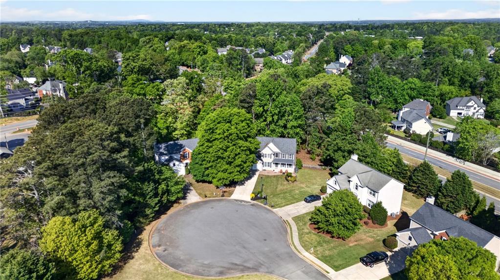 7830 Llangollen Way Cumming, GA 30041 - Photo 58 of 60 an aerial view of a house with a yard basket ball court and outdoor seating