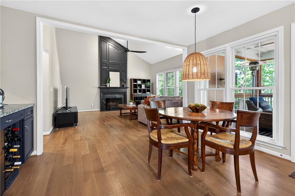 7830 Llangollen Way Cumming, GA 30041 - Photo 10 of 60 a view of a dining room with furniture window and wooden floor