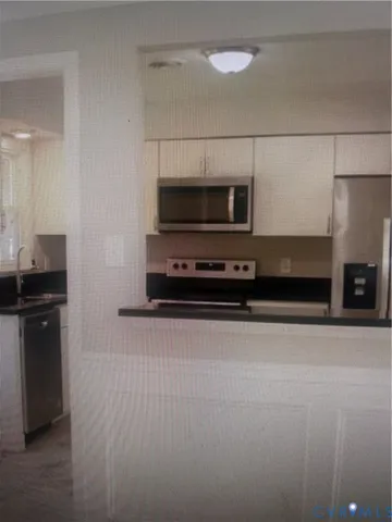 a view of kitchen and utility room