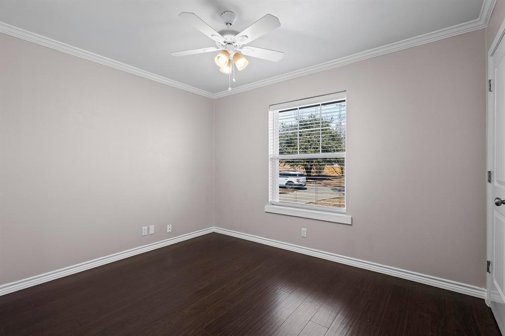 1135 Reed Circle Howe, TX 75459 - Photo 20 of 28 an empty room with wooden floor and windows