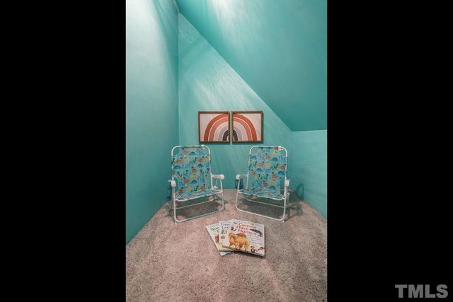 a view of a chairs and table on the wooden floor