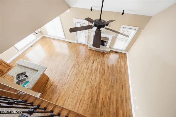 a view of a living room with wooden floor