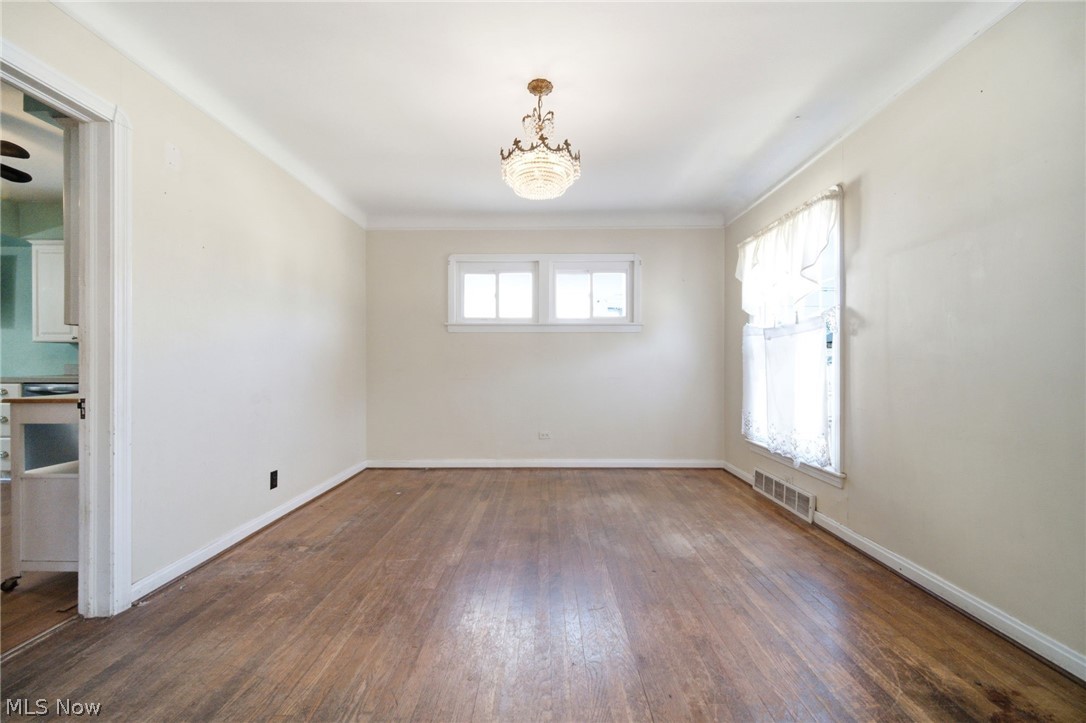 5003 West Ridgewood Drive Parma, OH 44134 - Photo 5 of 25 Bright and cheery dining room with built in china cabinet and wood floor!