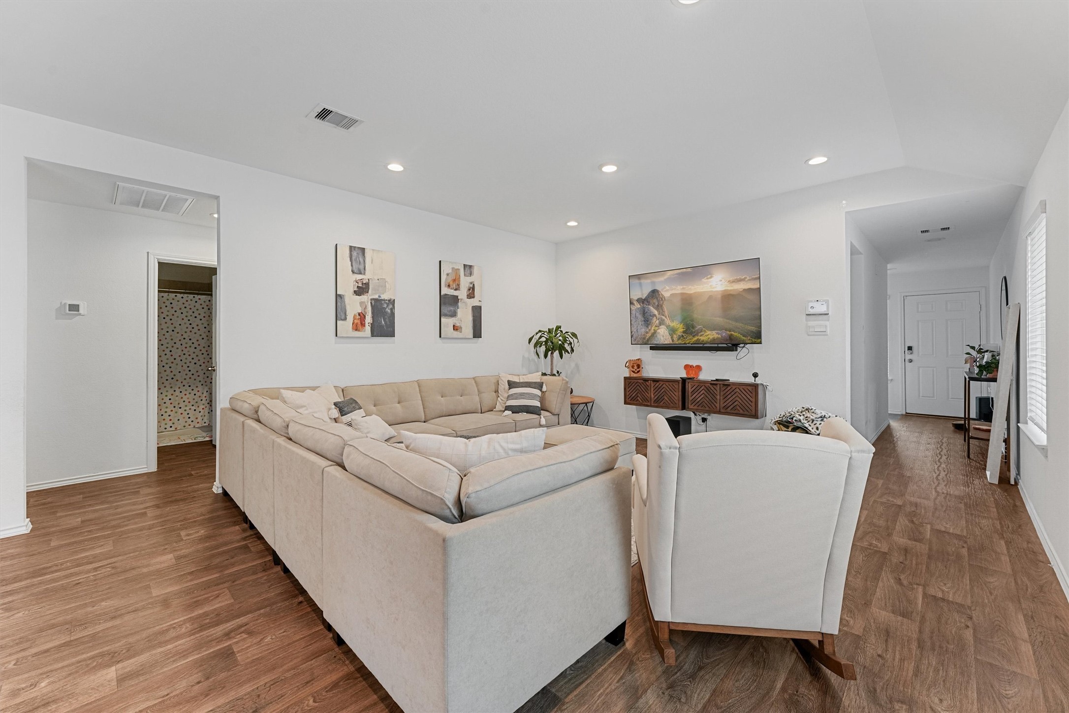 22411 Gilded Peak Lane Spring, TX 77373 - Photo 6 of 16 a living room with furniture and a flat screen tv