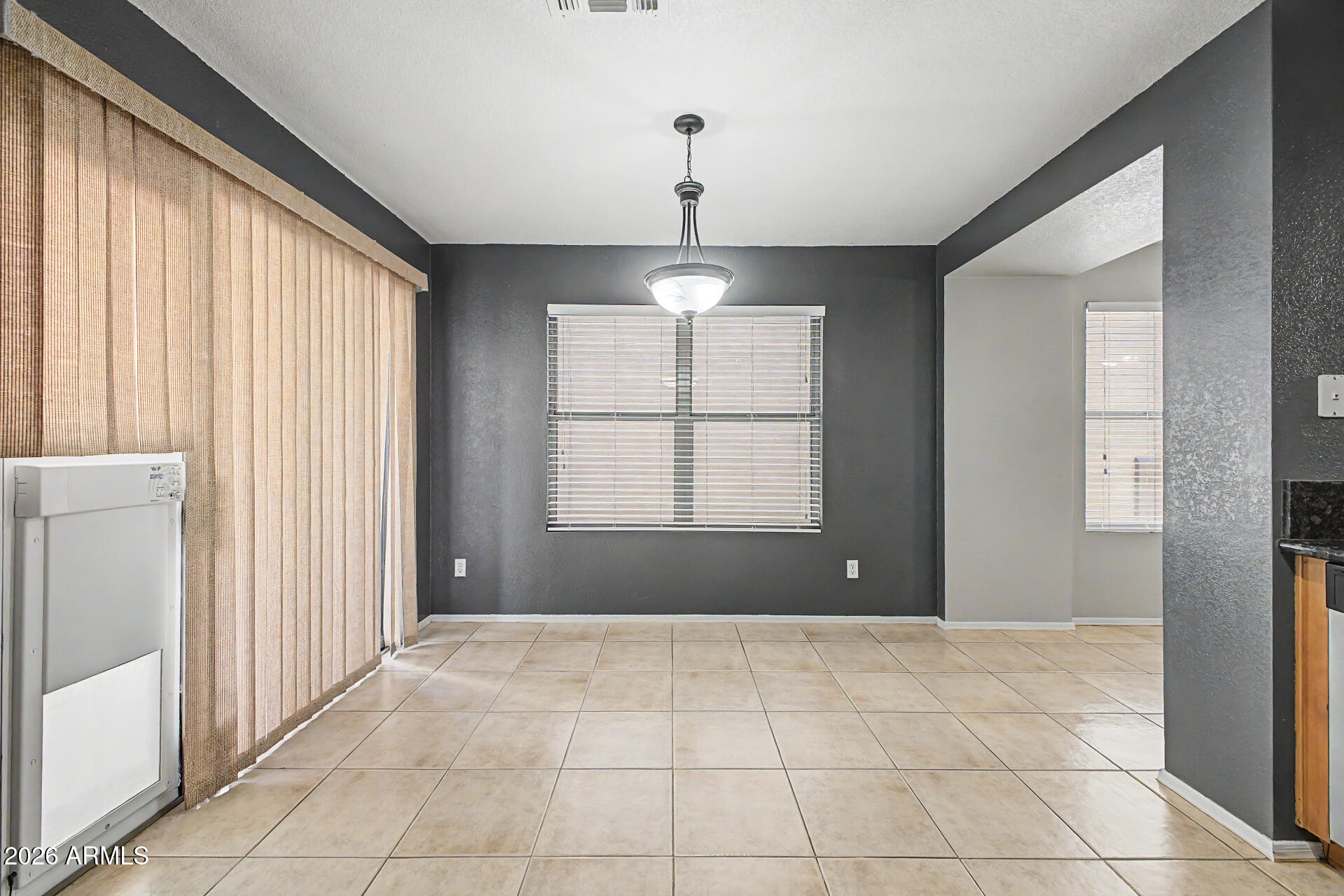 3489 South Bowman Road Apache Junction, AZ 85119 - Photo 14 of 24 a view of an empty room with a window