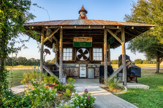 front view of a building with a garden