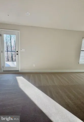 a view of a house with large windows