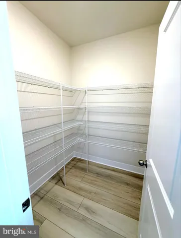a spacious bathroom with a sink and a mirror