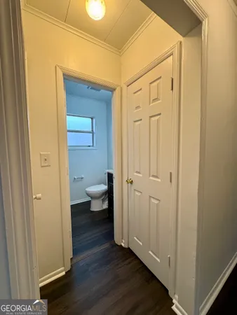 a view of a bathroom with wooden floor