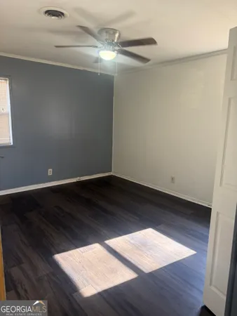 a view of wooden floor in an empty room