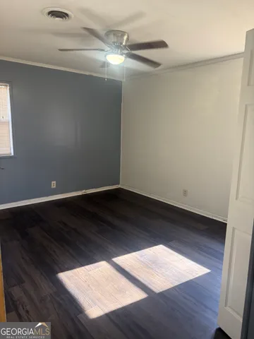 a view of wooden floor in an empty room
