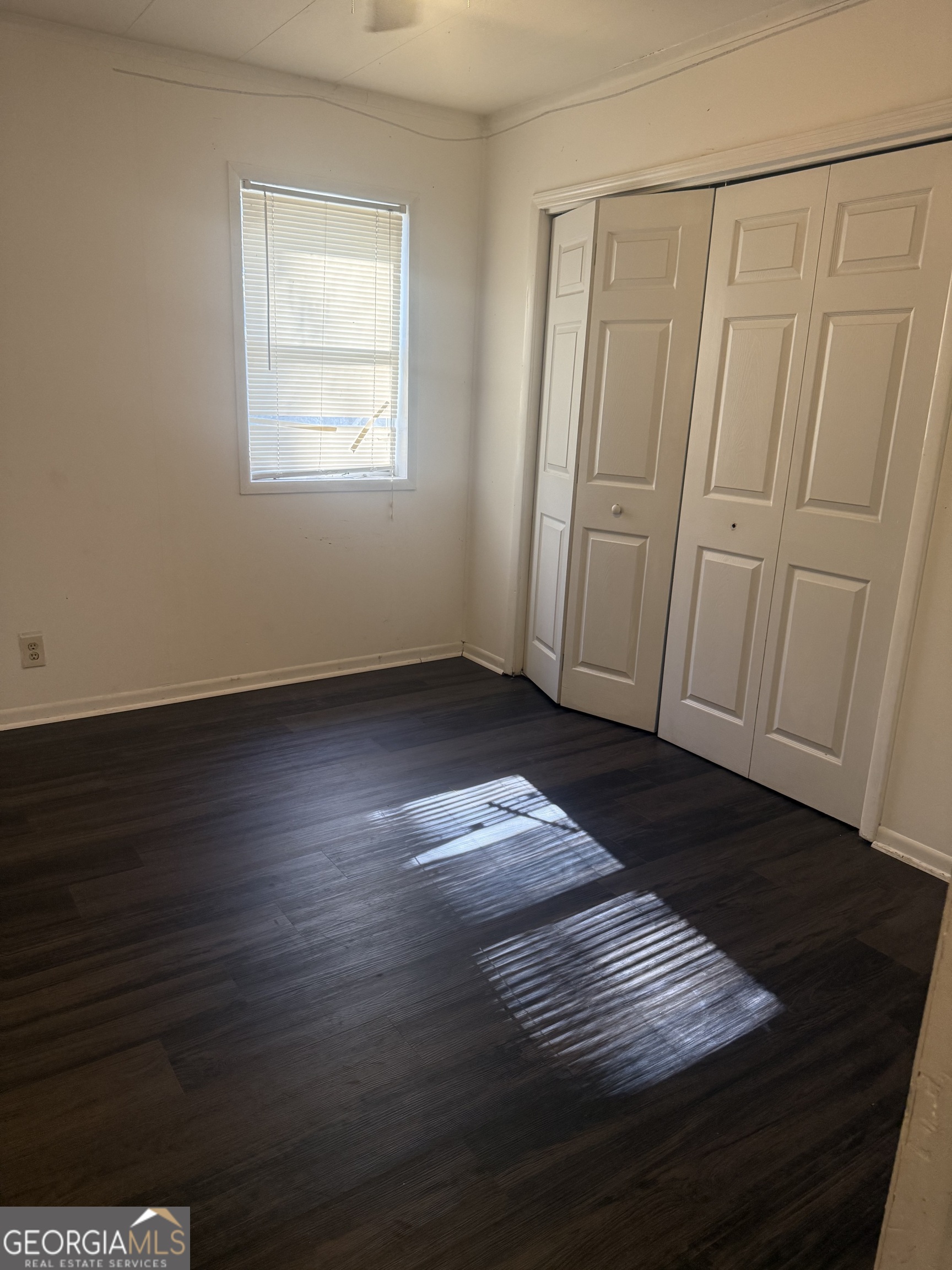 44 Armstead Drive Stockbridge, GA 30281 - Photo 6 of 20 wooden floor in an empty room with a window