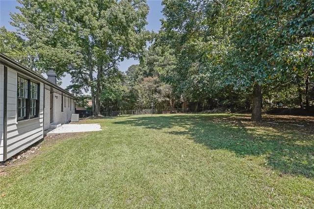 a view of backyard with green space