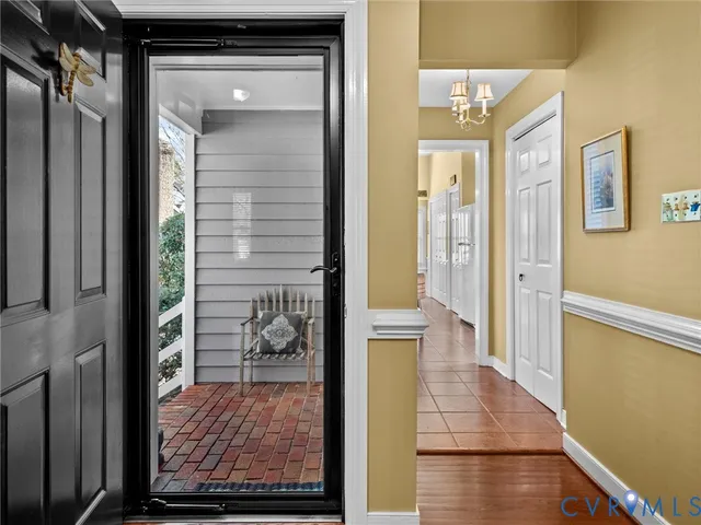 a living room with furniture a fireplace and a window