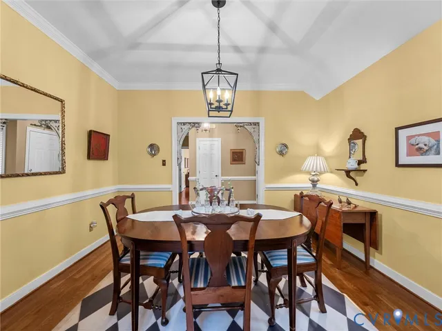 a living room with furniture a rug and a flat screen tv