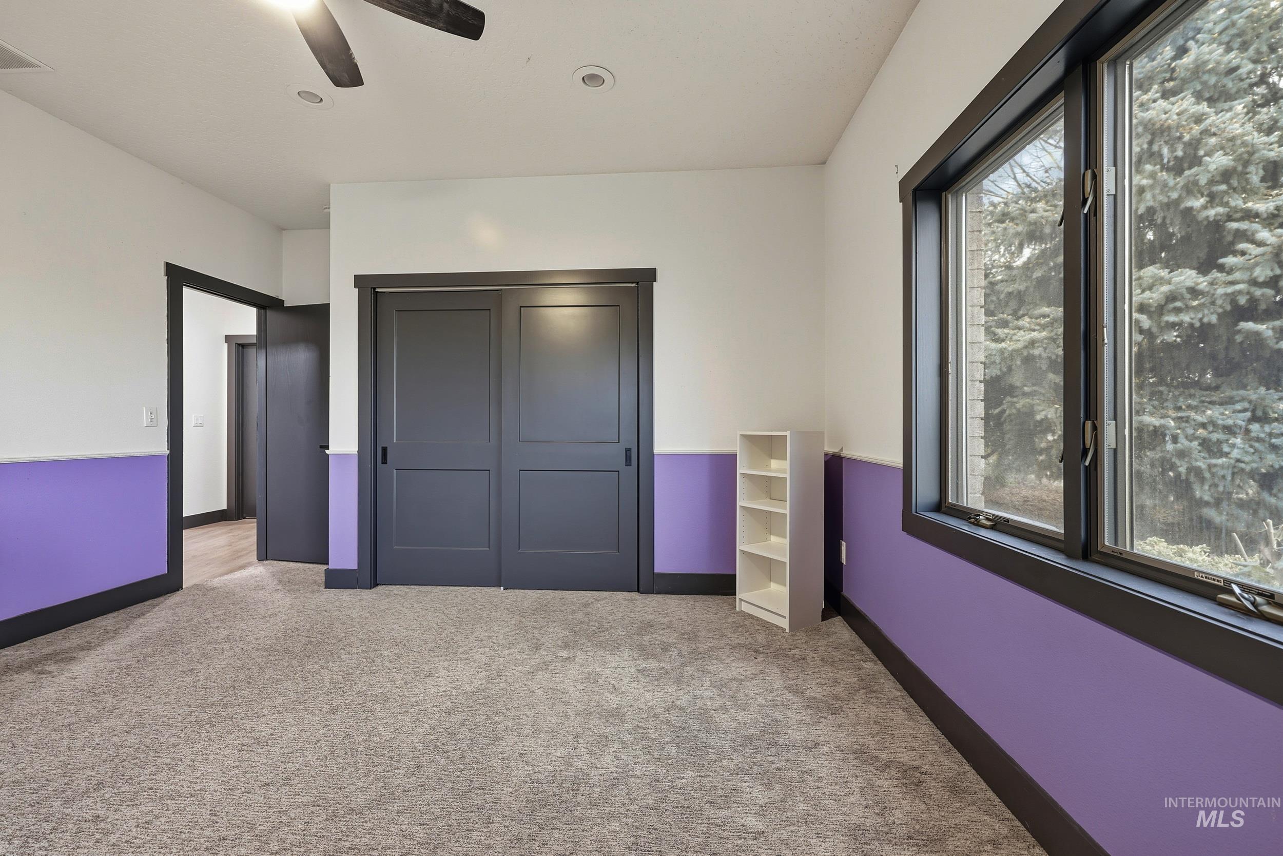 25300 Harvey Road Caldwell, ID 83607 - Photo 18 of 50 Unfurnished bedroom with a closet, carpet flooring, and a ceiling fan