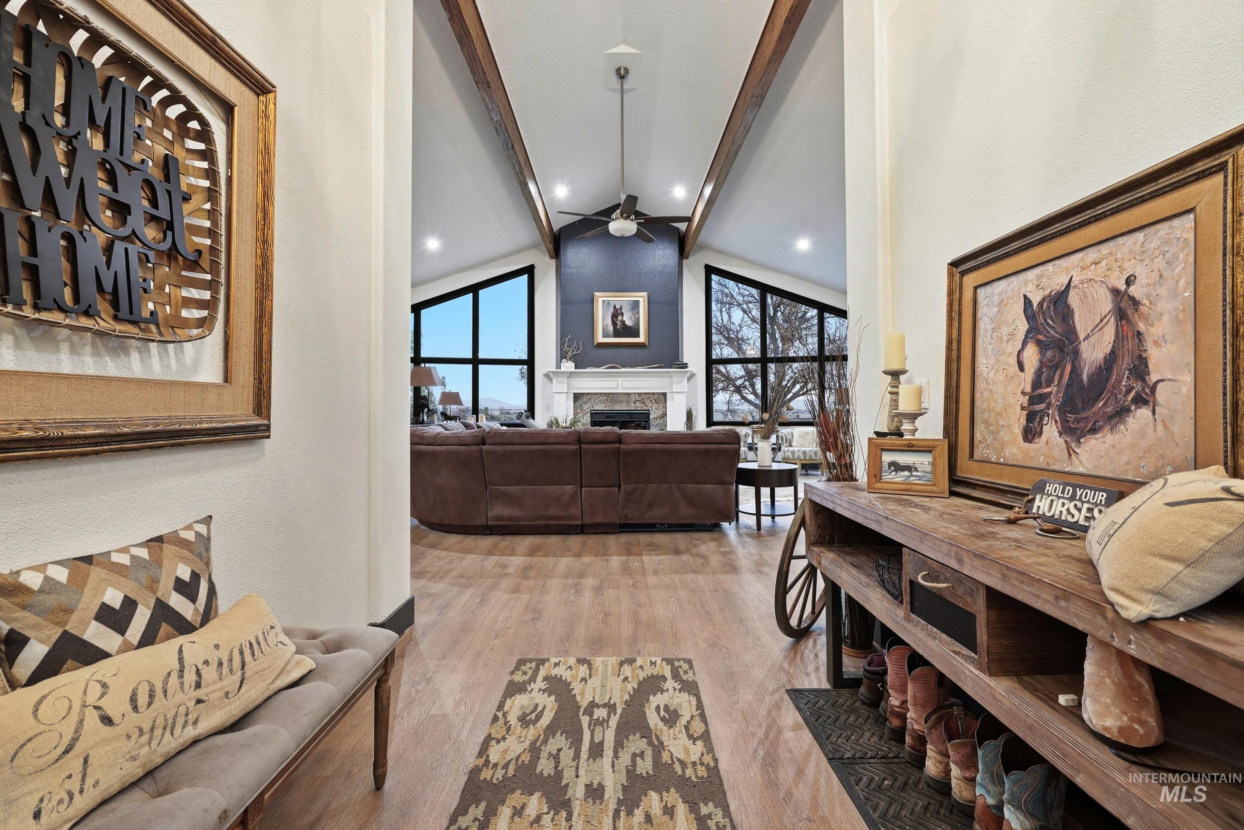 25300 Harvey Road Caldwell, ID 83607 - Photo 4 of 50 Hallway with light wood-type flooring, beamed ceiling, and high vaulted ceiling