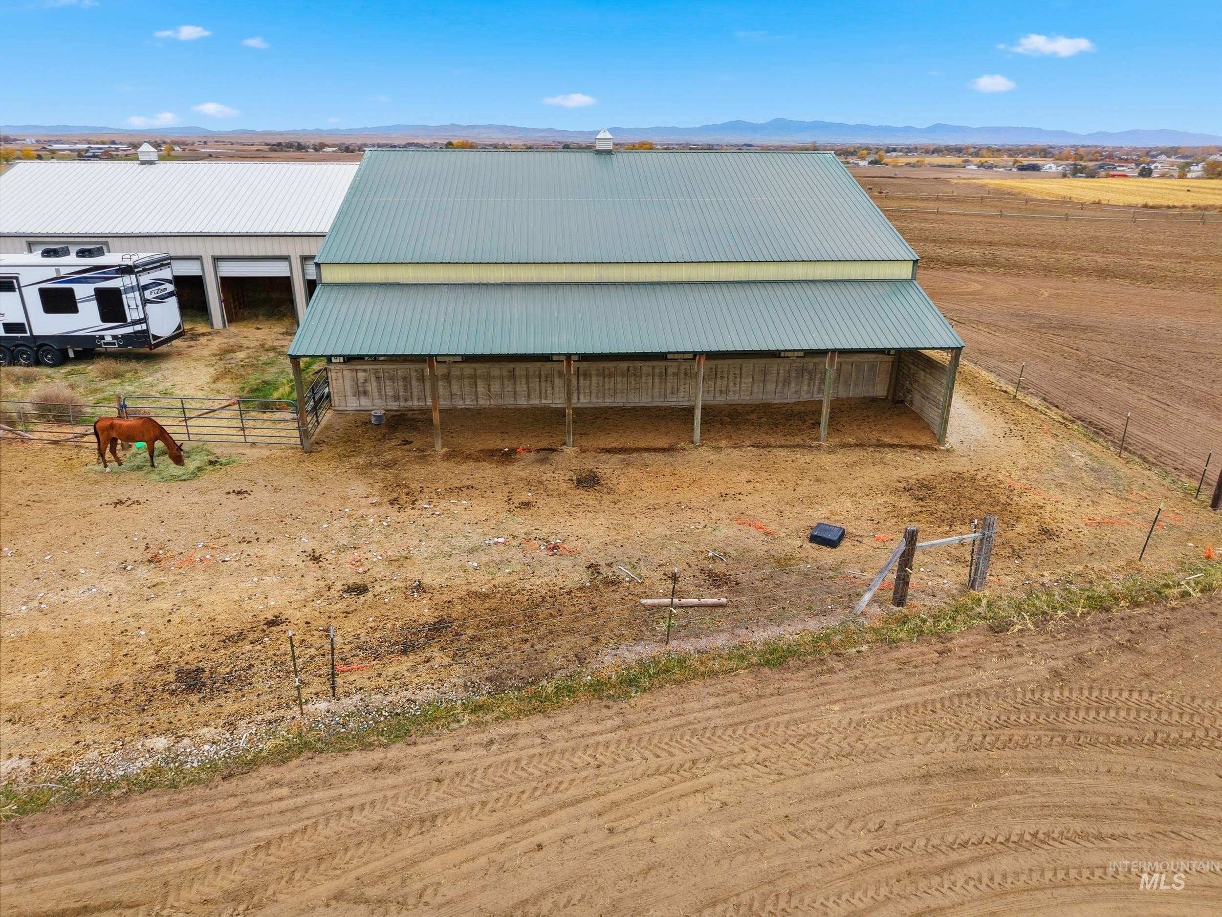 25300 Harvey Road Caldwell, ID 83607 - Photo 47 of 50 View of outdoor structure with a view of rural / pastoral area, a mountain view, and an exterior structure