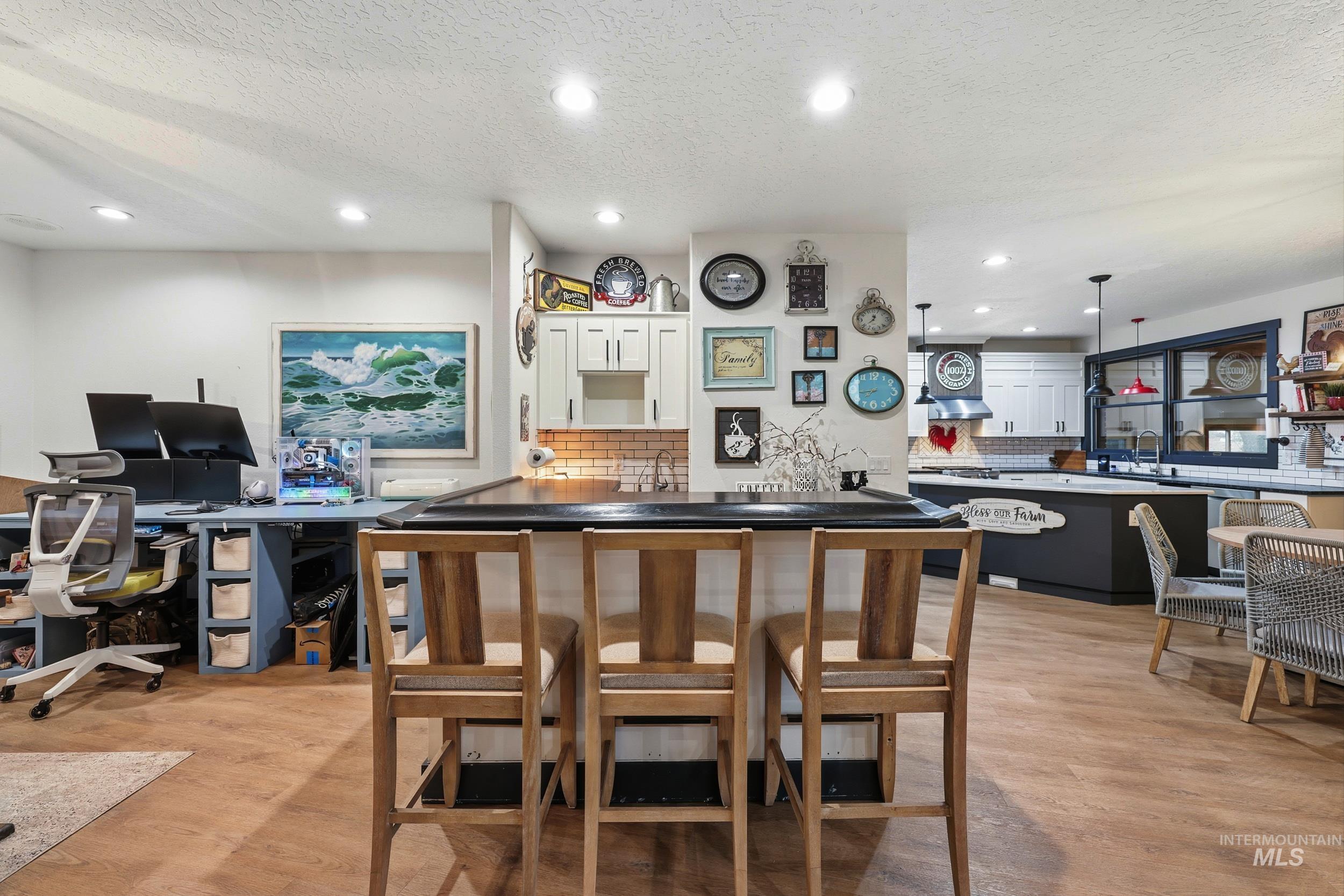 25300 Harvey Road Caldwell, ID 83607 - Photo 10 of 50 Bar featuring a textured ceiling, white cabinets, hanging light fixtures, open shelves, and recessed lighting