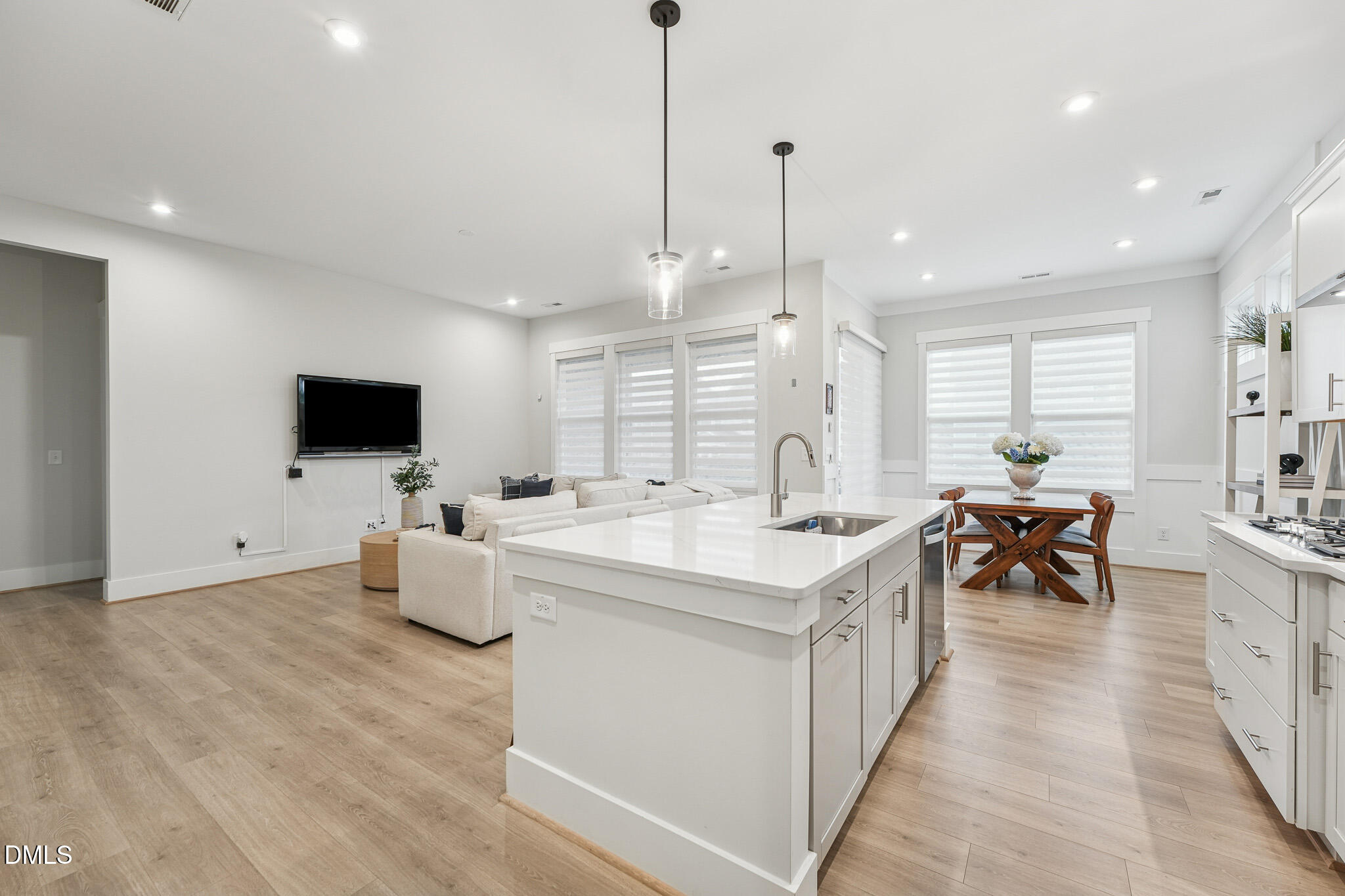5208 Windmere Chase Drive Raleigh, NC 27616 - Photo 11 of 42 a large white kitchen with a large island in the center