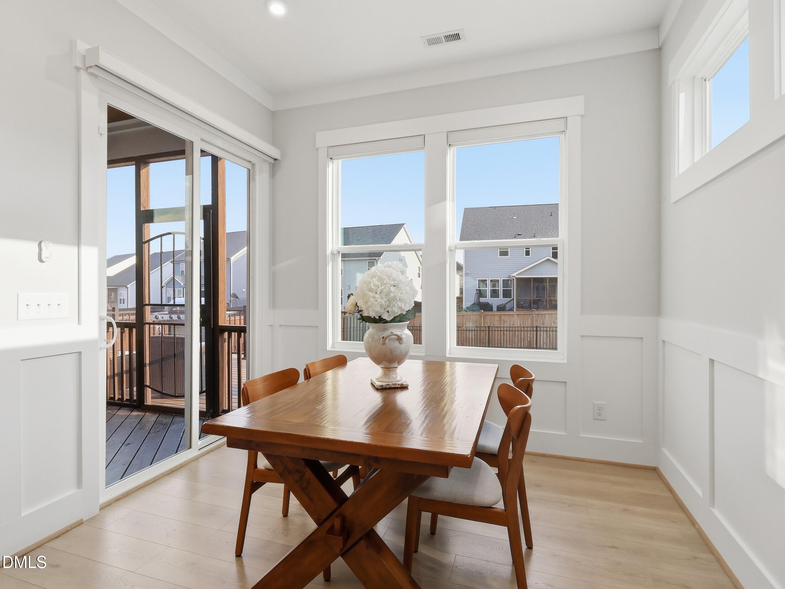 5208 Windmere Chase Drive Raleigh, NC 27616 - Photo 14 of 42 a dining room with furniture and window