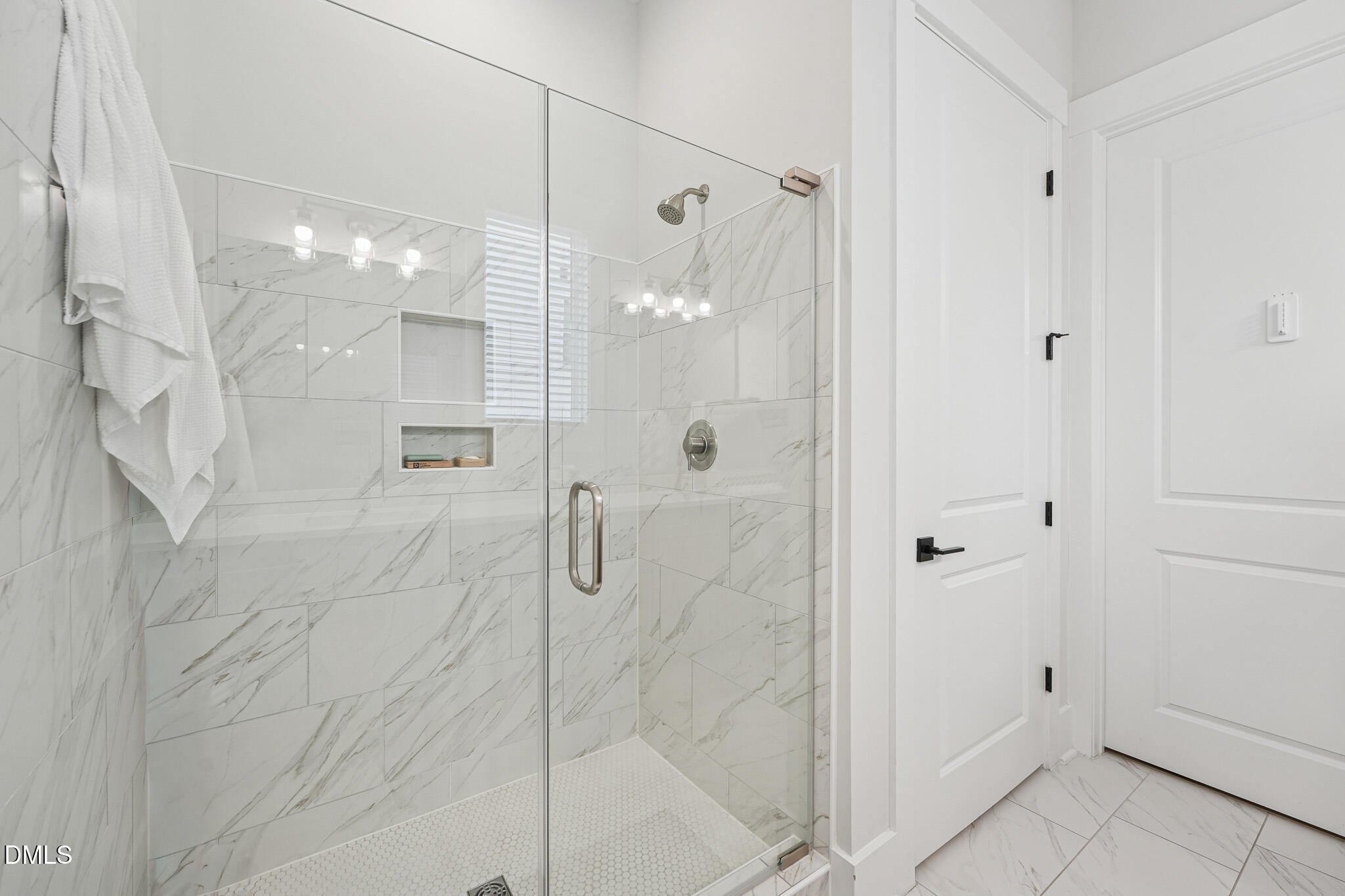 5208 Windmere Chase Drive Raleigh, NC 27616 - Photo 22 of 42 a bathroom with a glass shower door