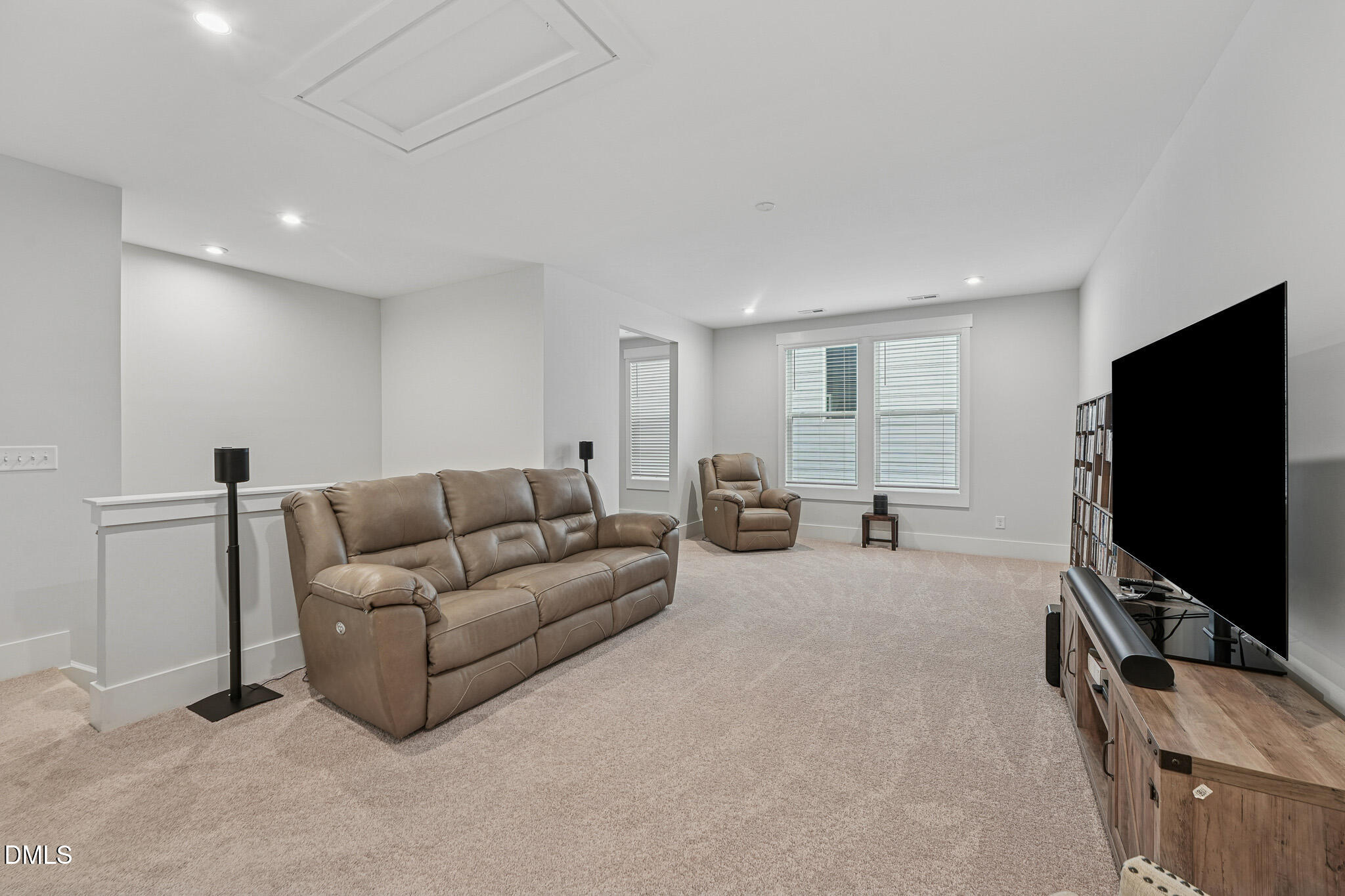 5208 Windmere Chase Drive Raleigh, NC 27616 - Photo 23 of 42 a living room with furniture and a flat screen tv