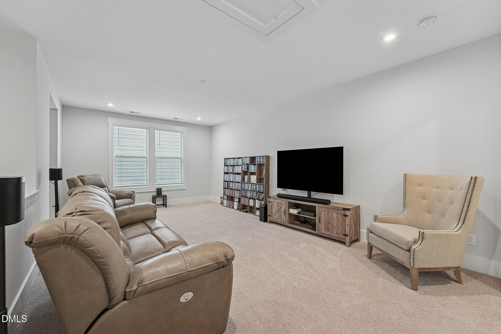 5208 Windmere Chase Drive Raleigh, NC 27616 - Photo 24 of 42 a living room with furniture and a flat screen tv