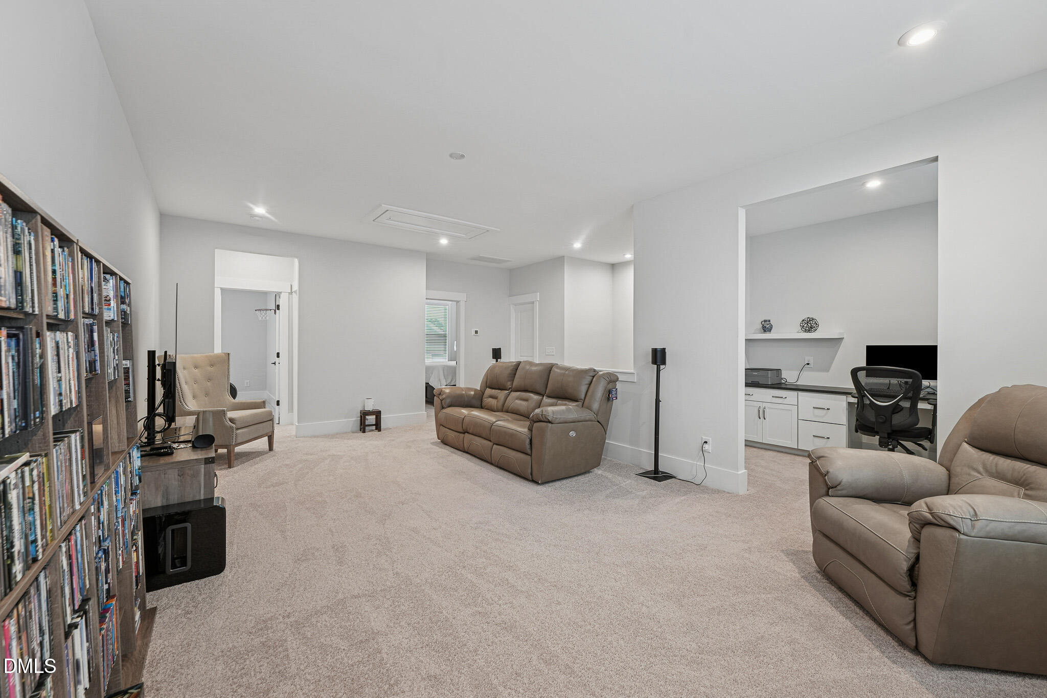5208 Windmere Chase Drive Raleigh, NC 27616 - Photo 25 of 42 a living room with furniture and a flat screen tv