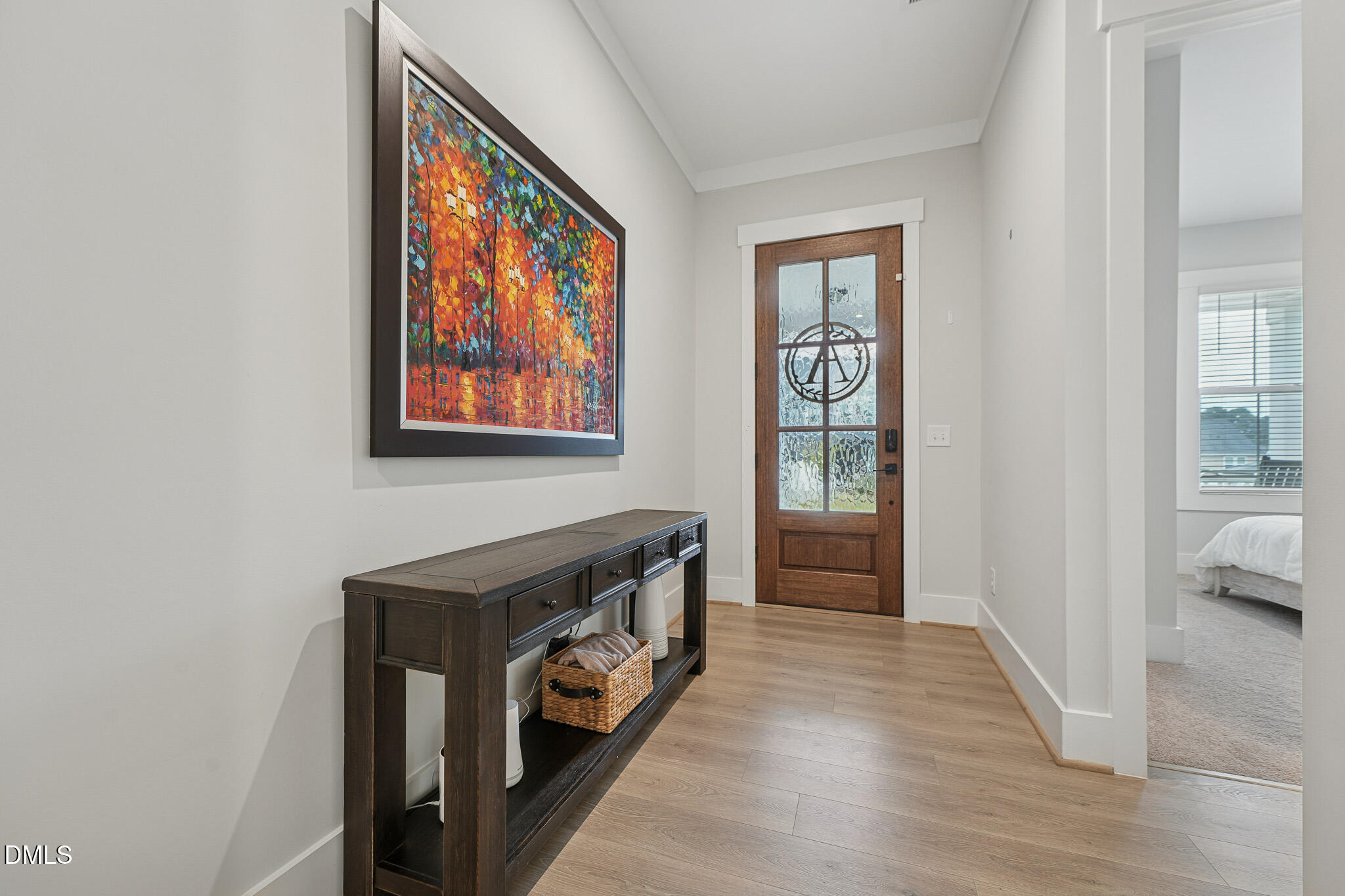 5208 Windmere Chase Drive Raleigh, NC 27616 - Photo 4 of 42 a view of a hallway to a livingroom with furniture
