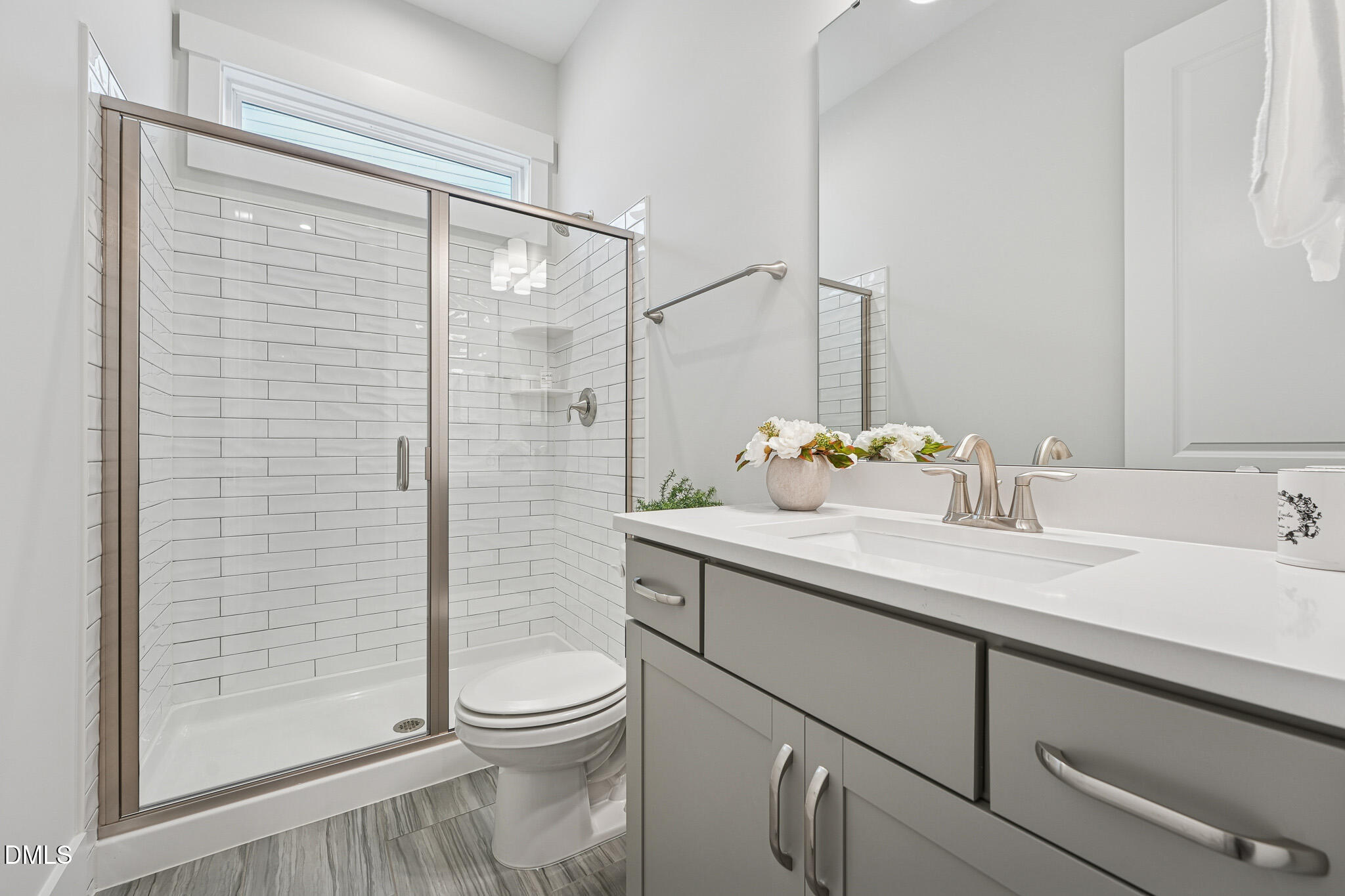 5208 Windmere Chase Drive Raleigh, NC 27616 - Photo 7 of 42 a bathroom with a sink a toilet and shower