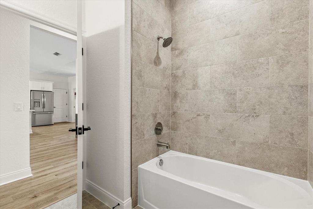 4457 Romano Street Sebring, FL 33872 - Photo 18 of 23 a bathroom with a bathtub