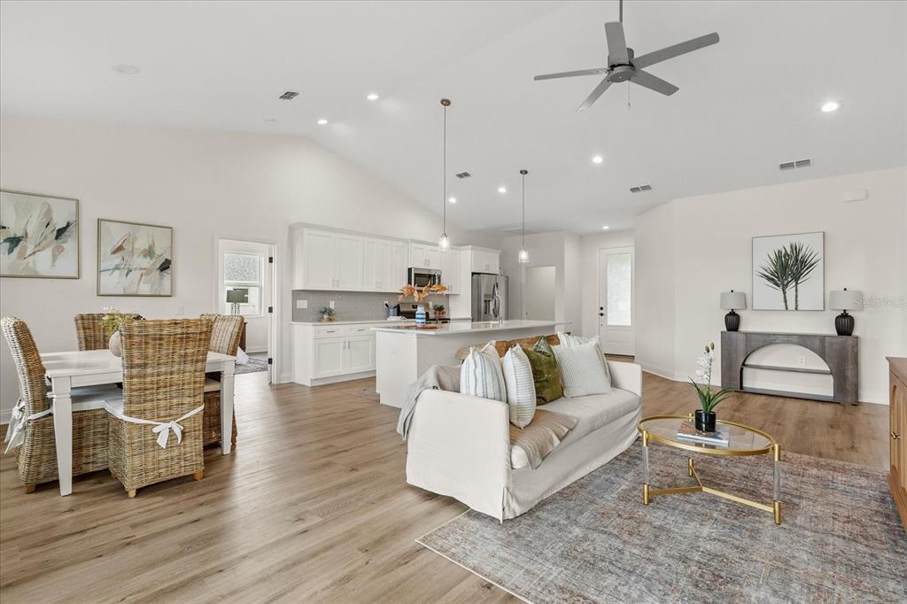 4457 Romano Street Sebring, FL 33872 - Photo 3 of 23 a living room with furniture and view of kitchen