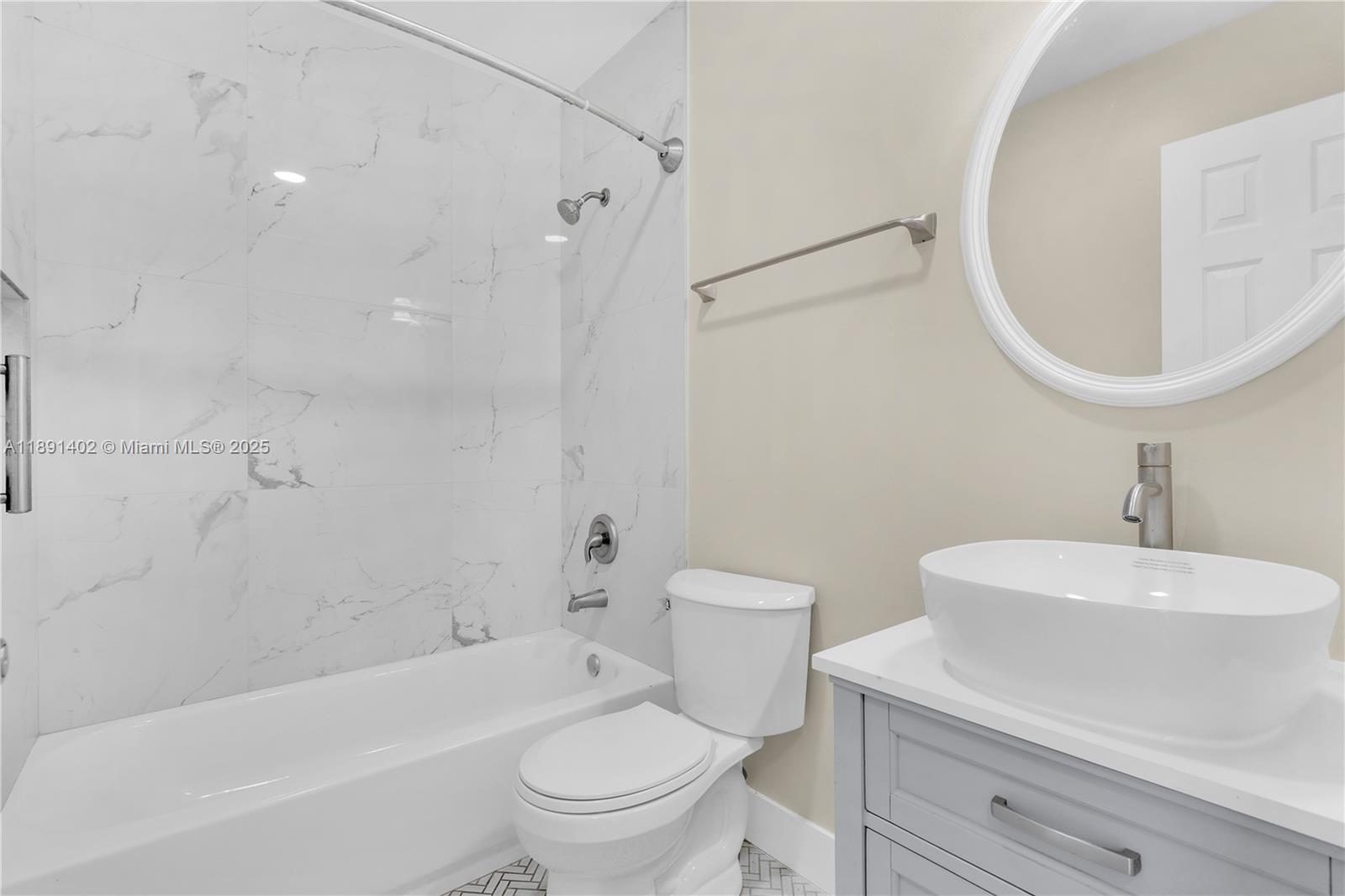 16215 Southwest 137th Court Miami, FL 33177 - Photo 12 of 30 a bathroom with a sink a toilet and a mirror