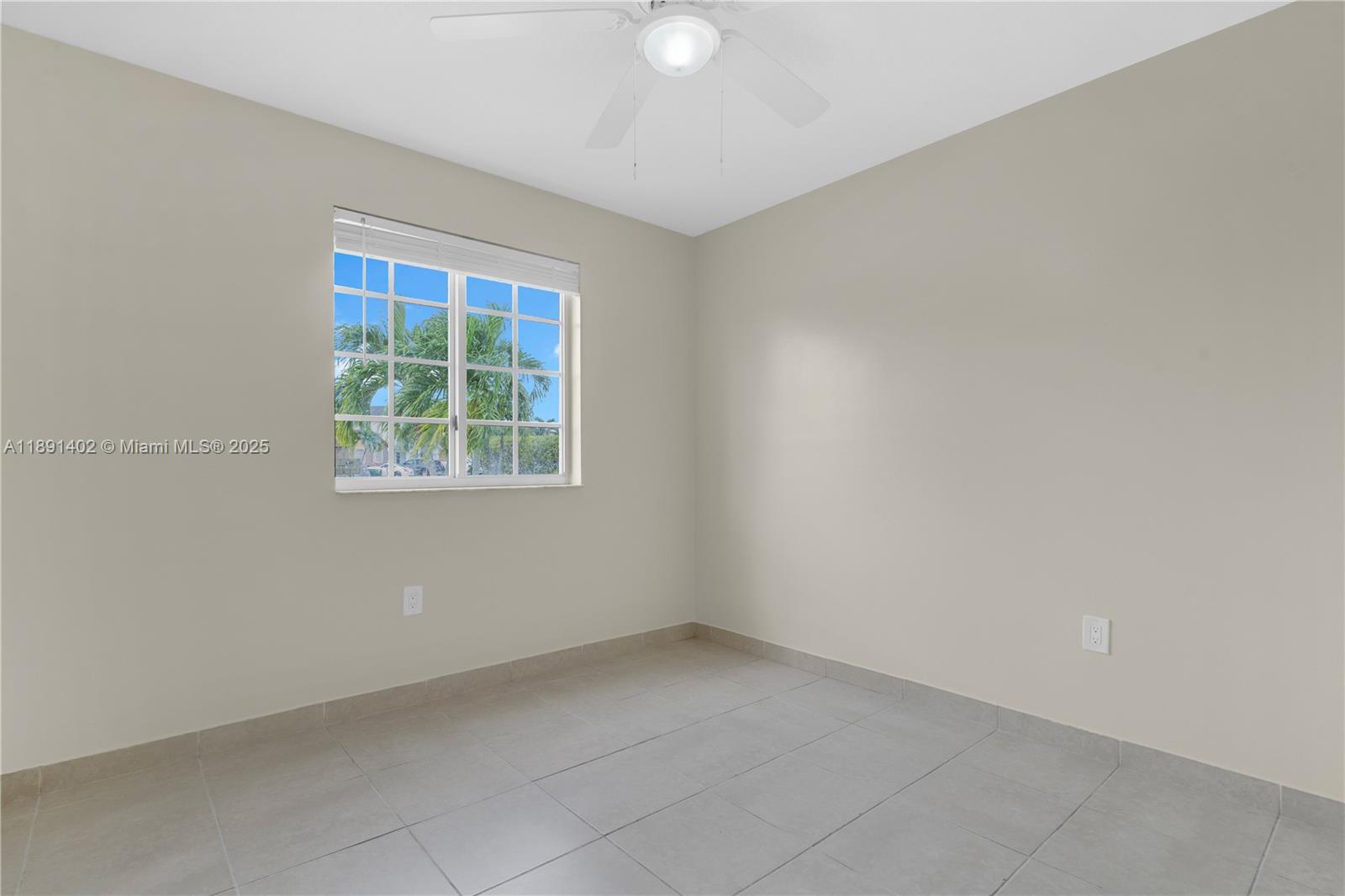 16215 Southwest 137th Court Miami, FL 33177 - Photo 13 of 30 an empty room with a window