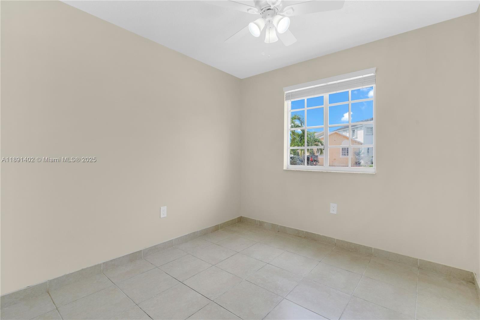 16215 Southwest 137th Court Miami, FL 33177 - Photo 16 of 30 an empty room with windows