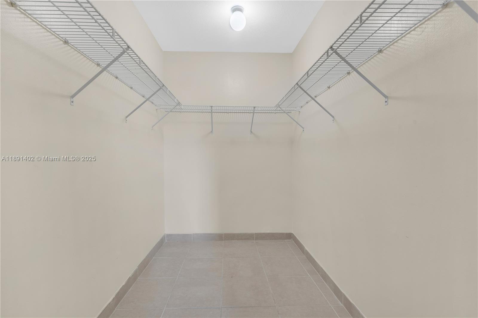 16215 Southwest 137th Court Miami, FL 33177 - Photo 23 of 30 a view of a room with racks on the wall