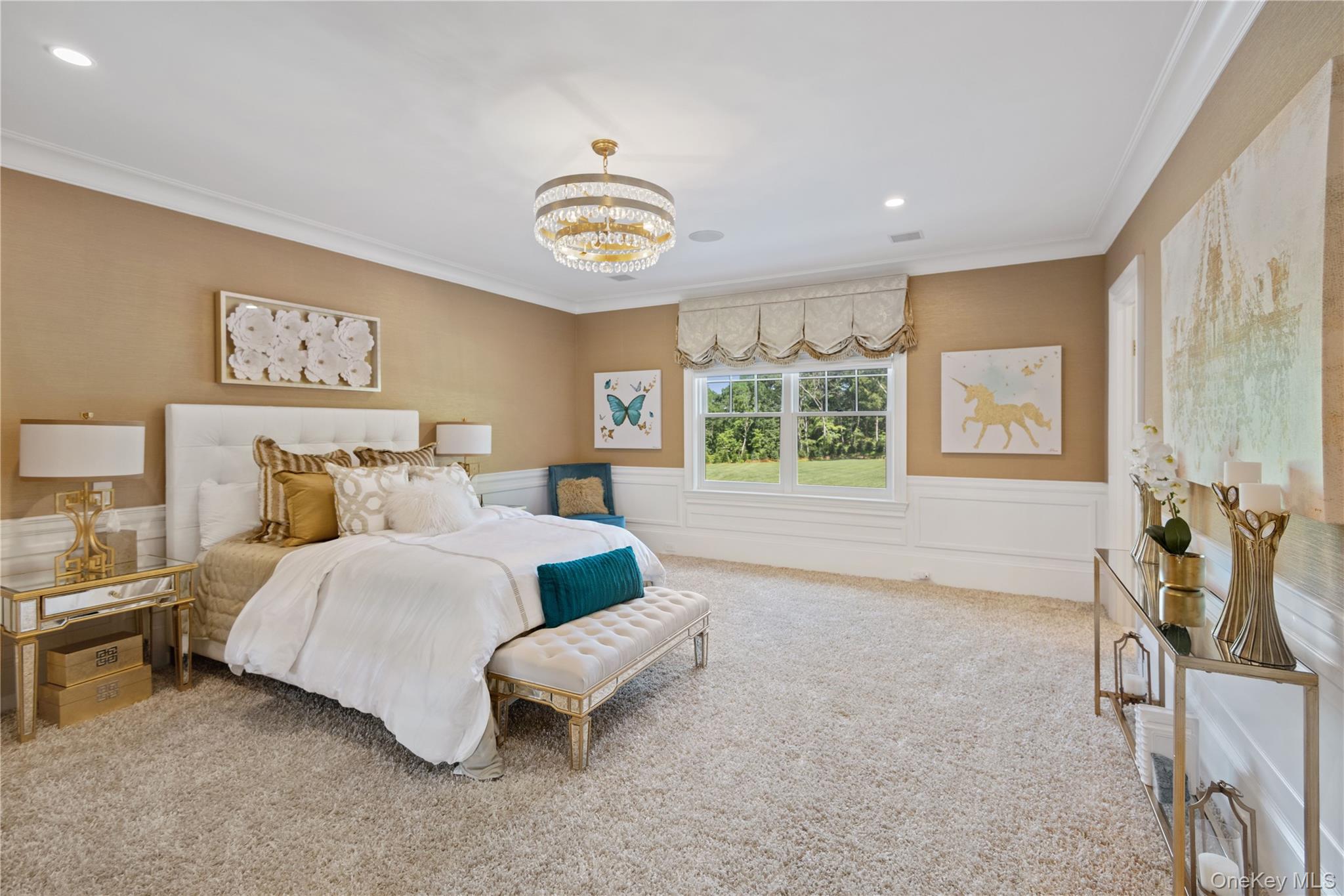 471 Woodbury Road Cold Spring Harbor, NY 11724 - Photo 19 of 36 a spacious bedroom with a bed and a large window