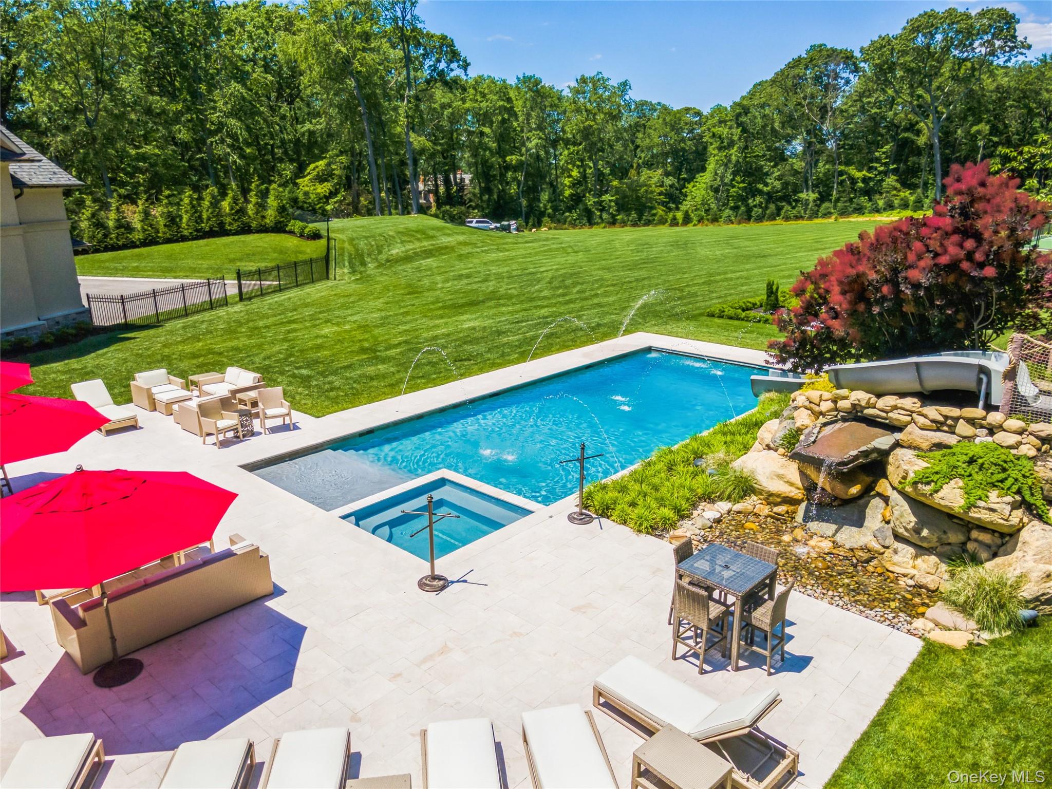 471 Woodbury Road Cold Spring Harbor, NY 11724 - Photo 35 of 36 a view of a backyard with a patio