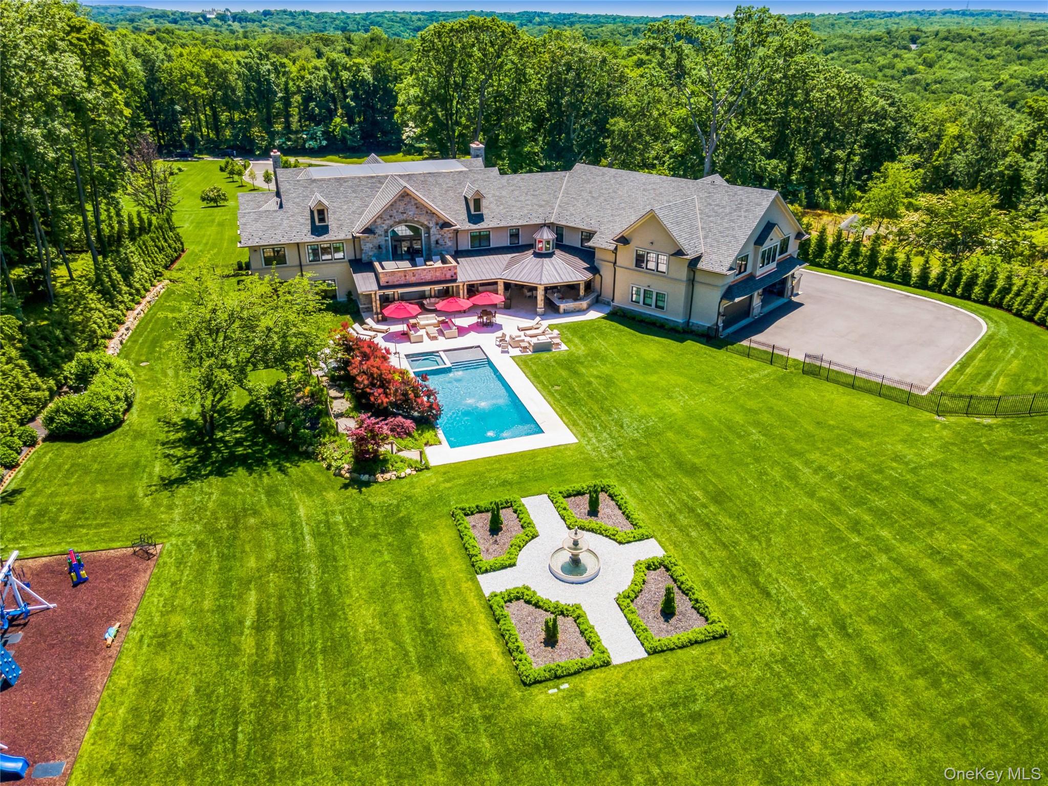 471 Woodbury Road Cold Spring Harbor, NY 11724 - Photo 36 of 36 an aerial view of a house with swimming pool garden and patio