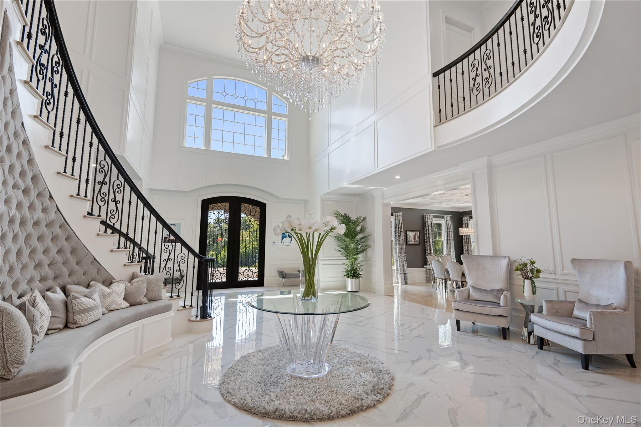 471 Woodbury Road Cold Spring Harbor, NY 11724 - Photo 4 of 36 a living room with furniture and a chandelier