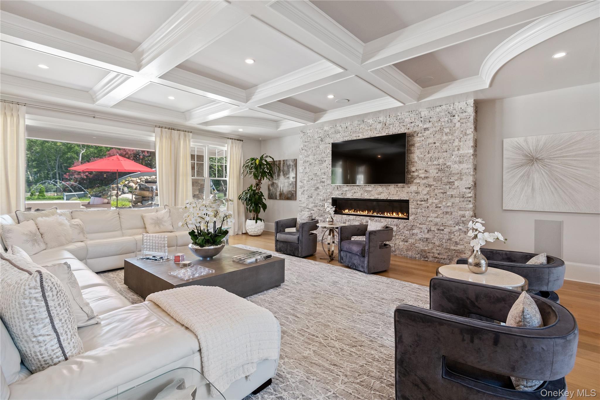 471 Woodbury Road Cold Spring Harbor, NY 11724 - Photo 6 of 36 a living room with furniture and a flat screen tv