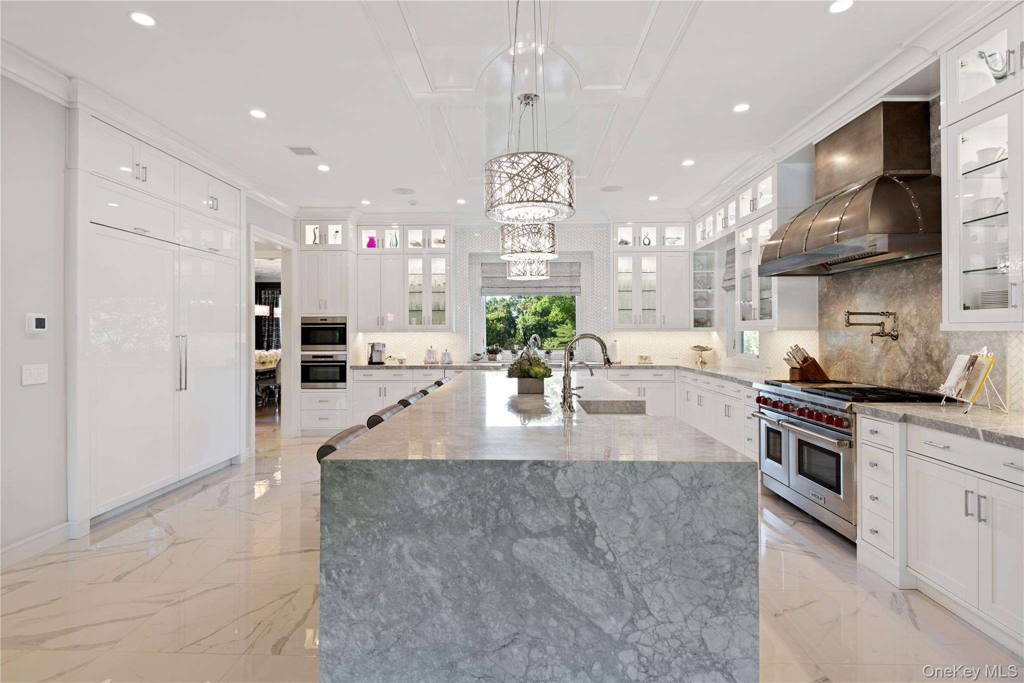 471 Woodbury Road Cold Spring Harbor, NY 11724 - Photo 9 of 36 a large kitchen with granite countertop a large counter top stainless steel appliances and cabinets