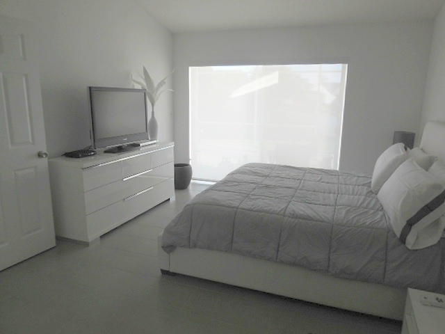 18253 Blue Lake Way Boca Raton, FL 33498 - Photo 22 of 33 MASTER BEDROOM SLIDER TO PATIO & LAKE
