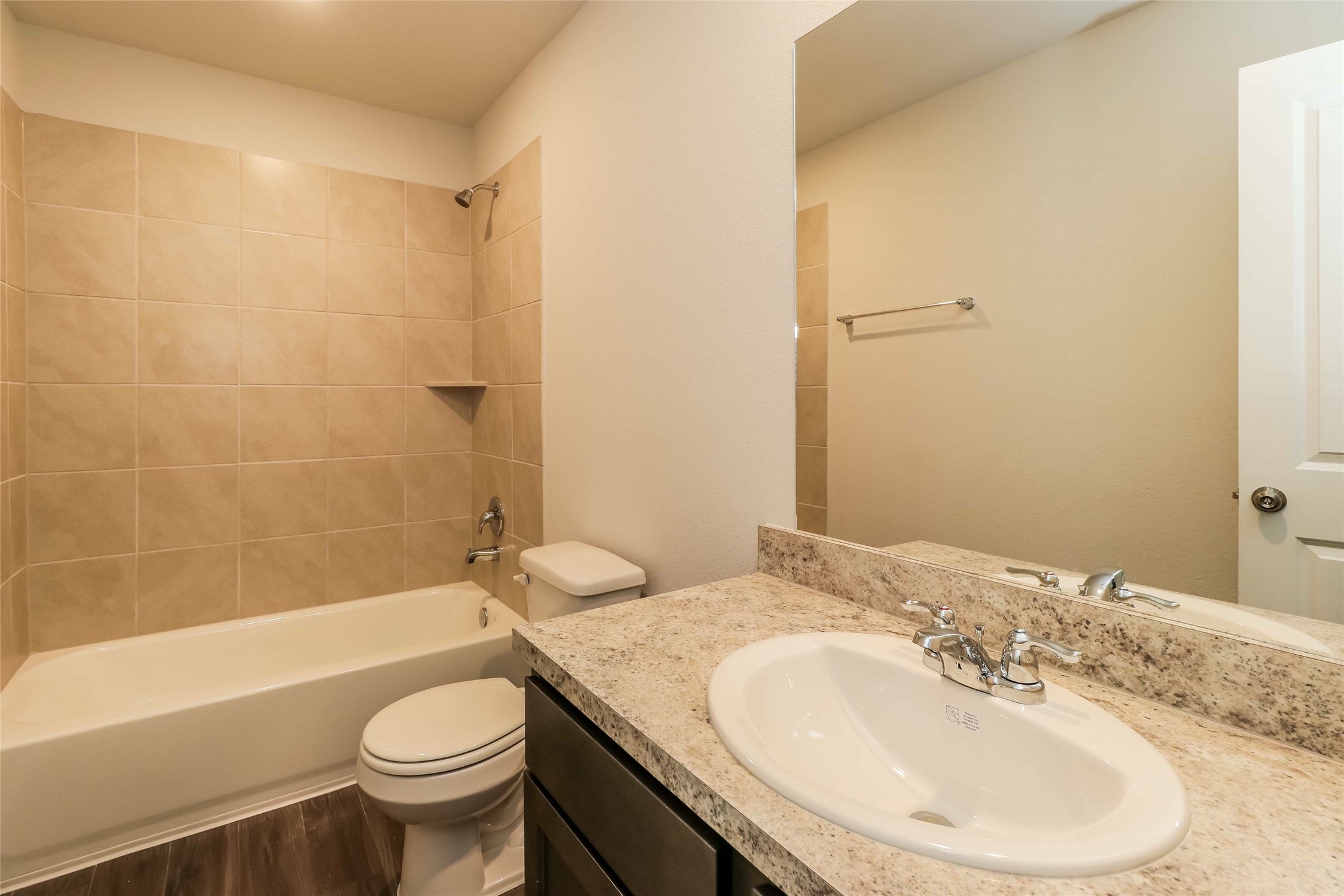 2501 Grayling Drive Conroe, TX 77384 - Photo 14 of 22 a bathroom with a granite countertop sink toilet and shower
