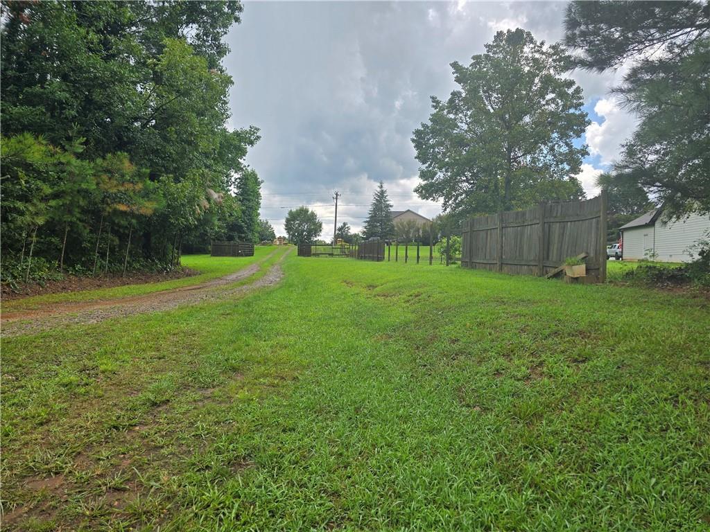 5725 Jot Em Down Road Cumming, GA 30041 - Photo 4 of 8 a view of a park with large trees